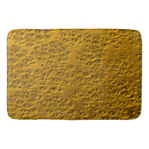 Damaged gold metal bath mat