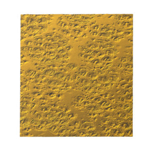 Damaged gold notepad