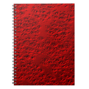Damaged red metal notebook