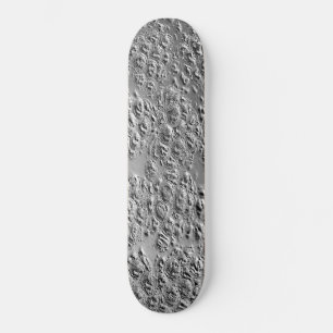 Damaged silver metal skateboard