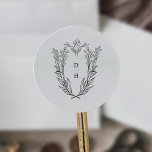 DAPHNE Simple Black White Vintage Wedding Monogram Classic Round Sticker<br><div class="desc">These simple black and white vintage wedding monogram stickers from the Daphne Collection are perfect for a traditional wedding.

The simple yet classic design features an elegant and timeless crest monogram with florals and greenery surrounding the initials of the couple.</div>