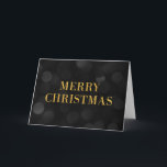 Dark Bokeh Lights Faux Gold Merry Christmas Holiday Card<br><div class="desc">Classy holiday greeting card featuring the words "Merry Christmas" in faux gold foil against a dark bokeh lights pattern background perfect for sending out holiday greetings to family, friends or business clients. To add text inside the the card click the "Customise" button. *Please note that the Zazzle Watermark that appears...</div>