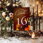 Dark Elegant Summer Sunset Floral Wedding Table Number<br><div class="desc">Celebrate the beginning of your forever with invitations as breathtaking as the sunset itself! Introducing our stunning sunset inspired wedding suite, adorned with a vibrant spray of realistic flowers in hues of orange, yellow, red, and pink, perfectly mirroring the colours of a picturesque sunset. Each petal and leaf is meticulously...</div>
