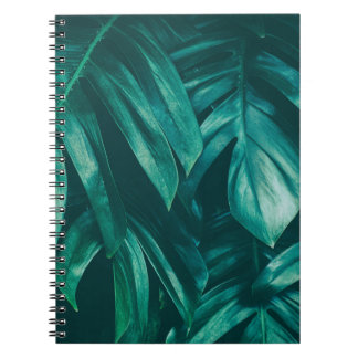 Dark green, tropical jungle foliage. notebook