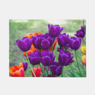 Dark purple tulips  on a sunny day in the garden  doormat