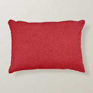 Dark red artificial leatherette closeup. decorative cushion