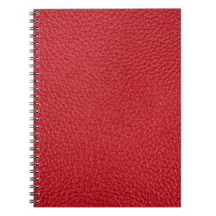 Dark red artificial leatherette closeup. notebook