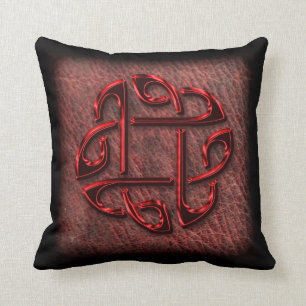 Dark red celtic knot on leather cushion