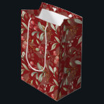 Dark Red Elegant Greenery Botanical Christmas  Medium Gift Bag<br><div class="desc">Designed in timeless Christmas colours of rich reds, vibrant greens, and elegant ivory, this bag exudes holiday charm. The custom dark red background adds a touch of sophistication, making your gift truly stand out. This versatile gift bag is the perfect finishing touch to any present, regardless of your style preferences....</div>
