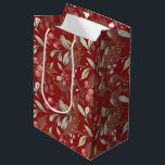 Dark Red Elegant Greenery Botanical Christmas  Medium Gift Bag<br><div class="desc">Designed in timeless Christmas colours of rich reds, vibrant greens, and elegant ivory, this bag exudes holiday charm. The custom dark red background adds a touch of sophistication, making your gift truly stand out. This versatile gift bag is the perfect finishing touch to any present, regardless of your style preferences....</div>