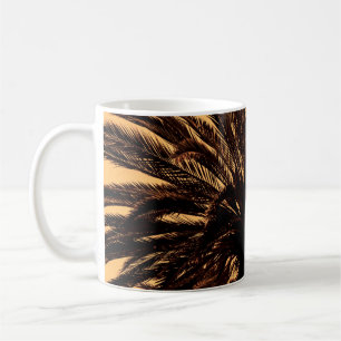 Dark silhouettes of date palms against bright colo coffee mug