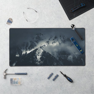 Darkness and clouds over the mountains desk mat
