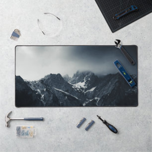 Darkness and storm brewing at mountains desk mat