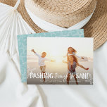 Dashing Through the Sand | Holiday Photo Card<br><div class="desc">Perfect for those living in tropical climes, or for sharing a favourite beach vacation photo, our coastal chic holiday photo card features "Dashing Through the Sand" as a white text overlay adorned with starfish illustrations. Personalise with your names and custom greeting (shown with "warmest wishes") along the bottom. Cards reverse...</div>