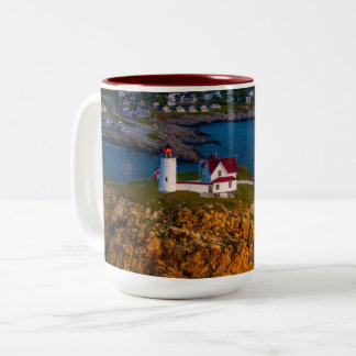 Dawns Light breaks on the Nubble's Rocky shoreline Two-Tone Coffee Mug