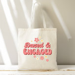 Dazed and engaged groovy retro daisy bachelorette tote bag<br><div class="desc">Dazed and engaged groovy retro daisy bachelorette party bridesmaid gifts,  dusty pink retro daisy groovy vibes bachelorette weekend party gifts welcome gifts tote bag</div>
