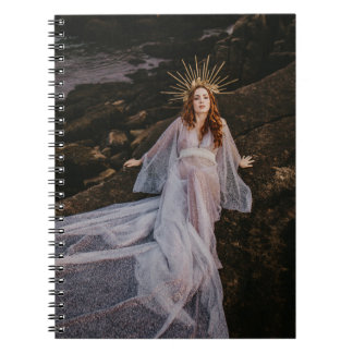 dazzling women laying on rocks spiral note book