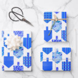 Decorated Dreidels White Wrapping Paper Sheet<br><div class="desc">This bright,  contemporary Hanukkah design features simple shapes and intricate patterns in a classic blue and white palette. 3 sheets of white print.</div>