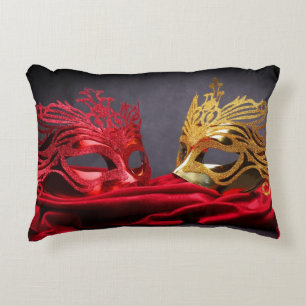 Decorated masquerade mask on red velvet decorative cushion