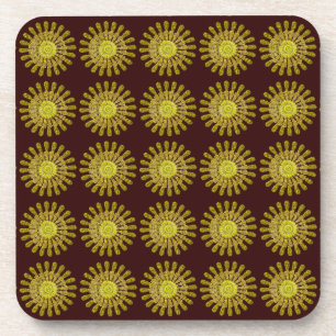 Decorative golden sun symbol coaster