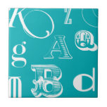 Decorative Letters on Blue Background Tile<br><div class="desc">A veritable alphabet soup awaits you when you purchase this print of decorative letters on a blue background. A Vision Studio creation, this would be a great addition to a kid's room or their playroom. Order a print today!</div>