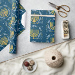 Decorative Menorah Hanukkah Holiday Wrapping Paper<br><div class="desc">Add some festivity to your wrapped Chanukah presents this season. This decorative Hanukkah wrapping paper features a gold menorah surrounded by leaves,  stars,  and swirls against a rich blue background. Available with matching products.</div>
