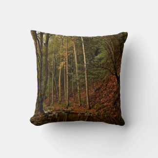 Decorative pillow with trees in a fall decor