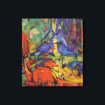 Deer in the Forest II by Franz Marc, Vintage Art Canvas Print<br><div class="desc">Deer in the Forest II (1914) by Franz Marc is a vintage expressionism fine art wild animal painting. Several forest creatures, deer, a stag and a baby doe with spots, lying down in a forest surrounded by trees. A beautiful, bright, colourful background. About the artist: Franz Marc (1880-1916) was a...</div>