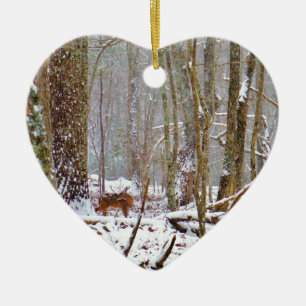Deer in the snow, licking leg ceramic tree decoration