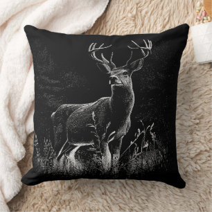 Deer with antlers framed by field and tree    cushion