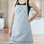 Delicate Floral Monogram Blue Gingham Cottagecore Apron<br><div class="desc">Beautiful cottagecore apron that will protect your clothes and make you pretty at the same time when you whip up delicious dishes and bake yummy cookies in your sunny kitchen. With your monogram inside a delicate diamond-shaped floral wreath with blue flowers and tiny yellow berries against a printed gingham look...</div>