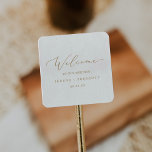 Delicate Gold Calligraphy Wedding Welcome Square Sticker<br><div class="desc">These delicate gold calligraphy wedding welcome stickers are perfect for a modern wedding. The romantic minimalist design features lovely and elegant champagne golden yellow typography on a white background with a clean and simple look. Personalise these stickers with the location of your wedding, names, and wedding date. These labels are...</div>