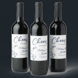 Delicate orchid cheers to the wedding blue custom wine label<br><div class="desc">Elegant customisable wine labels for your wedding reception, featuring beautiful and delicate Prussian blue orchids line drawing on one side, over a classic white background, and the wording "Cheers to the wedding of" in dark blue fonts. Easily edit the template fields to add the bride and groom names in a...</div>