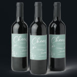 Delicate orchid cheers to the wedding green custom wine label<br><div class="desc">Elegant customisable wine labels for your wedding reception, featuring beautiful and delicate white orchids line drawing on one side, over a romantic sage mint green background, and the wording "Cheers to the wedding of" in white fonts. Easily edit the template fields to add the bride and groom names in a...</div>
