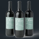 Delicate orchid cheers to the wedding green custom wine label<br><div class="desc">Elegant customisable wine labels for your wedding reception, featuring beautiful and delicate white orchids line drawing on one side, over a romantic sage mint green background, and the wording "Cheers to the wedding of" in white fonts. Easily edit the template fields to add the bride and groom names in a...</div>