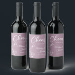 Delicate orchid cheers to wedding purple custom wine label<br><div class="desc">Elegant customisable wine labels for your wedding reception, featuring beautiful and delicate white orchids line drawing on one side, over a romantic dusty purple background, and the wording "Cheers to the wedding of" in white fonts. Easily edit the template fields to add the bride and groom names in a classy...</div>