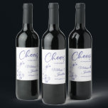 Delicate orchid cheers to wedding purple custom wine label<br><div class="desc">Elegant customisable wine labels for your wedding reception, featuring beautiful and delicate periwinkle purple orchids line drawing on one side, over a classic white background, and the wording "Cheers to the wedding of" in purple fonts. Easily edit the template fields to add the bride and groom names in a classy...</div>
