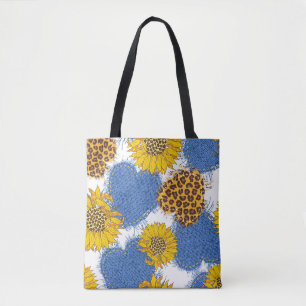 Denim hearts made of fabric with torn edges and le tote bag