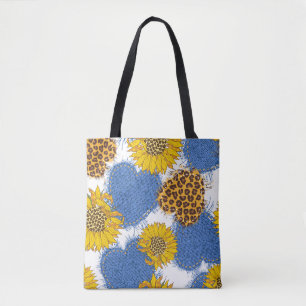 Denim hearts made of fabric with torn edges and le tote bag