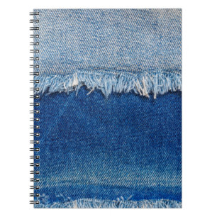 Denim jeans background. Ripped denim fabric with b Notebook