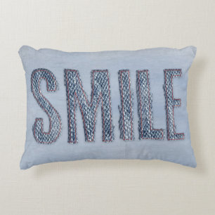 denim smile with red stitching decorative cushion