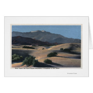 Desert Sand Dunes and Snow-Capped Mountains