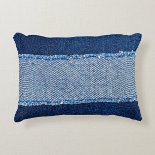 Destroyed torn denim blue jeans fabric frame on bl decorative cushion