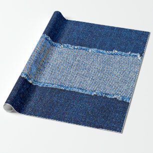 Destroyed torn denim blue jeans fabric frame on bl wrapping paper