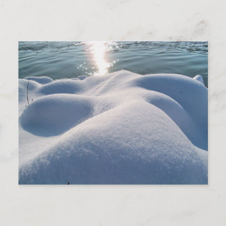 Detail of frozen river bank,ice,stone,sand,water.. postcard