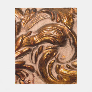 detail of ornamental picture frame, bronze color.  fleece blanket