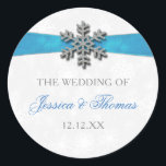 Diamante Snowflake & Blue Ribbon Winter Wedding Classic Round Sticker<br><div class="desc">The diamante snowflake & blue ribbon wedding collection is perfect for any couple planning a romantic winter wedding celebration. The design features a light silvery grey and white snowflake textured background with a diamante snowflake on top of a silky looking ribbon. The wording incorporates the same silvery grey and blue...</div>