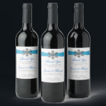 Diamante Snowflake & Blue Ribbon Winter Wedding Wine Label<br><div class="desc">The diamante snowflake & blue ribbon wedding collection is perfect for any couple planning a romantic winter wedding celebration. The design features a light silvery grey and white snowflake textured background with a diamante snowflake on top of a silky looking ribbon. The wording incorporates the same silvery grey and blue...</div>