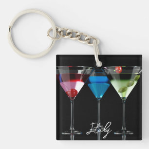 Different cocktails in martini glasses on black key ring