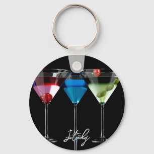 Different cocktails in martini glasses on black key ring